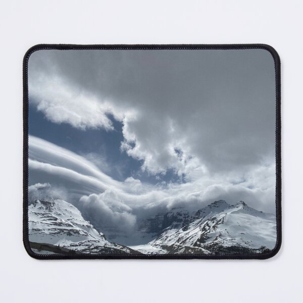 Item preview, Snowy winter mountains and avalanche flowing into the clouds and mountains designed and sold by MostSplendid.