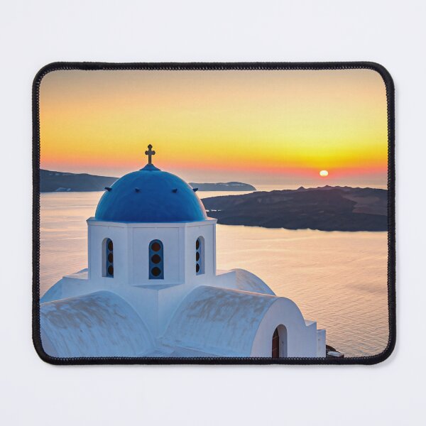 Item preview, A picturesque whitewashed church with a blue dome sits atop a cliff overlooking the Aegean Sea at sunset designed and sold by homydesign.