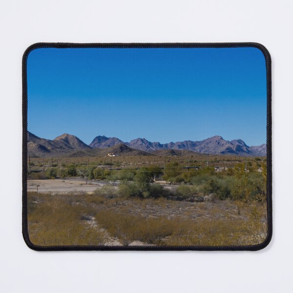 Item preview, A vast desert landscape stretches towards a range of rugged mountains under a clear blue sky designed and sold by EyezWatchin.