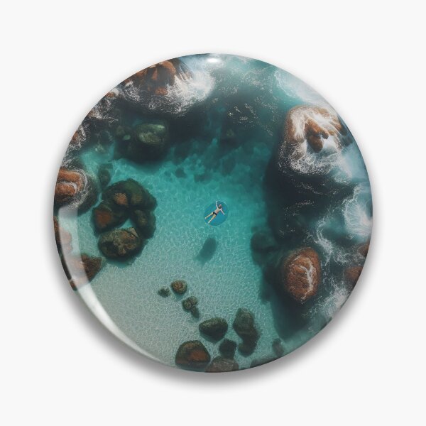 Artikelvorschau, Luftaufnahme einer Person, die in einer ruhigen Meeresbucht schwimmt, umgeben von schroffen Klippen entworfen und verkauft von homydesign.