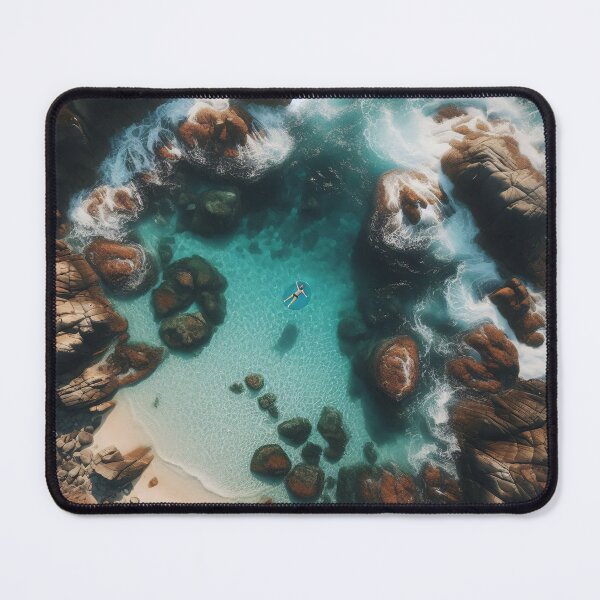 Item preview, Aerial view of a person floating in a serene sea cove surrounded by rugged cliffs designed and sold by homydesign.