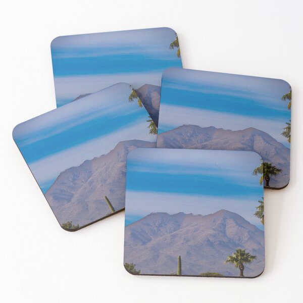 Item preview, A majestic mountain range towers under a clear blue sky, with tall palm trees in the foreground adding a tropical feel to the desert landscape designed and sold by EyezWatchin.