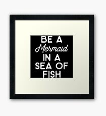 Be a mermaid in a sea of fish. Framed Print