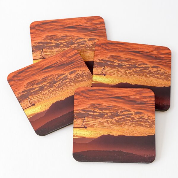 Item preview, Silhouette of construction crane against sky and hill tops at sunset designed and sold by MAMB007.