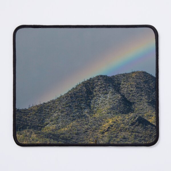 Item preview, A vibrant rainbow stretches across a mountainous landscape covered in desert vegetation designed and sold by EyezWatchin.