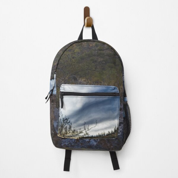 Item preview, A mountain Tucson AZ rocky foreground leads to a hillside covered in sparse vegetation and cacti under a dramatic sky designed and sold by EyezWatchin.