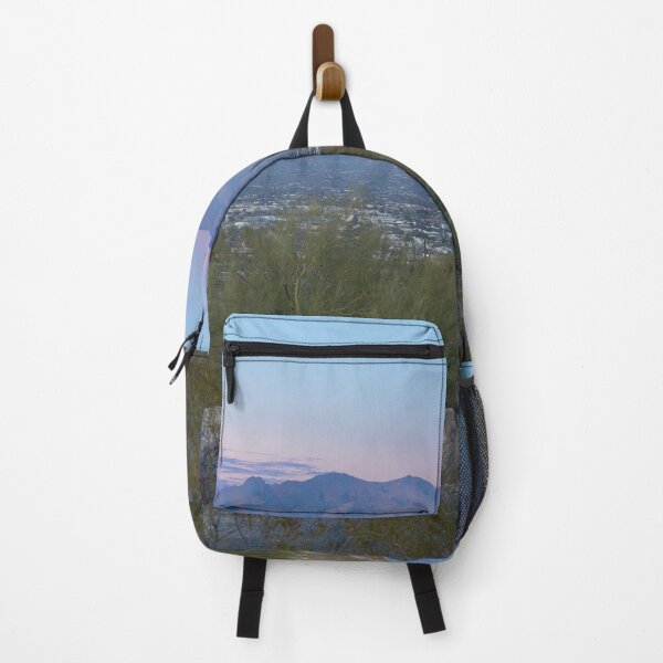Item preview, Tucson AZ city view under mountains under a dusky sky with desert rocks and foliage designed and sold by EyezWatchin.