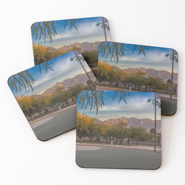 Item preview, A serene landscape captures a park at sunrise with lush green trees and majestic Catalina Mountains designed and sold by EyezWatchin.