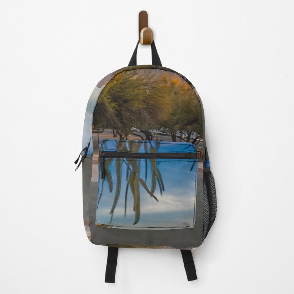 Item preview, A serene landscape captures a park at sunrise with lush green trees and majestic Catalina Mountains designed and sold by EyezWatchin.