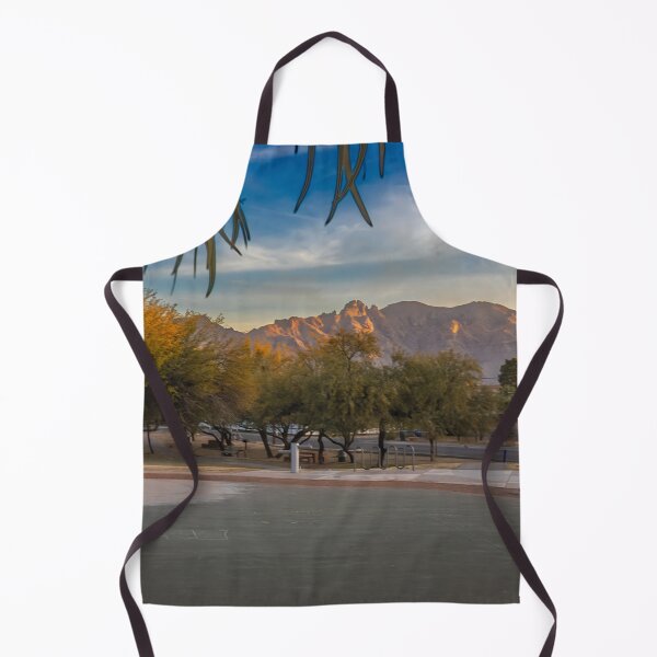 Item preview, A serene landscape captures a park at sunrise with lush green trees and majestic Catalina Mountains designed and sold by EyezWatchin.