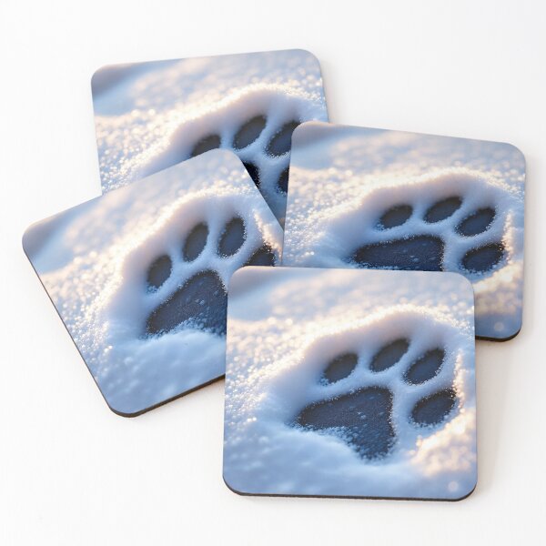 Item preview, A close-up view of a dog's paw print imprinted in the snow. designed and sold by artumbre.