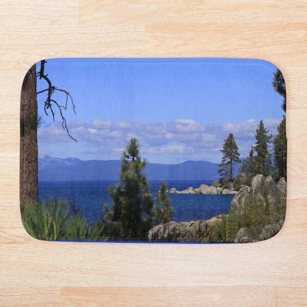 Item preview, Lake Tahoe California with blue water, Trees, sky and a Mountain. designed and sold by ROBERTDBROZEK.