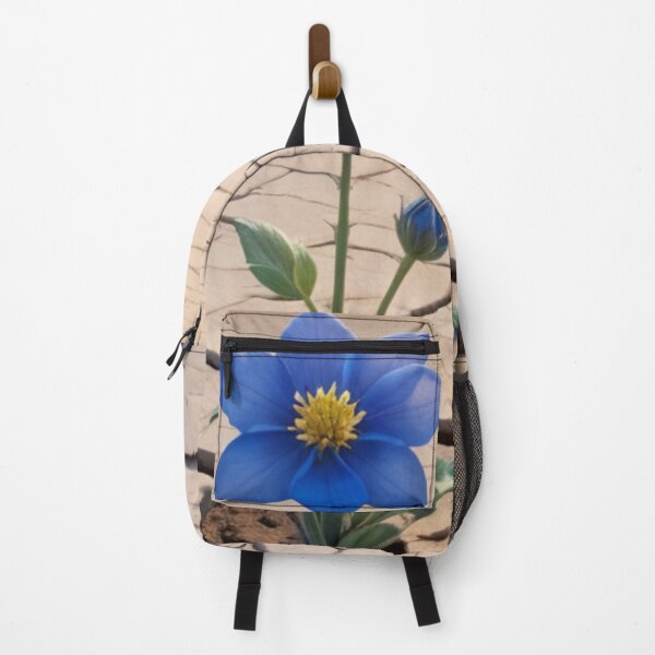Item preview, Blue Flower Growing In Barren Desert Posters designed and sold by EthosWear.
