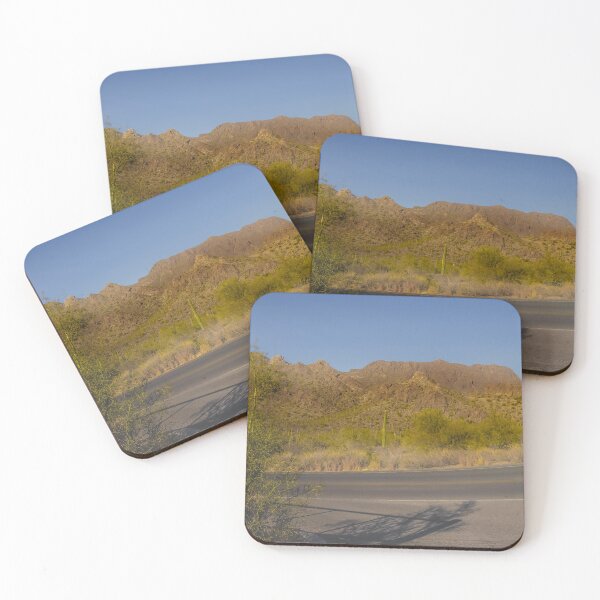 Item preview, A winding desert road curves through a landscape dotted with cacti, set against a backdrop of distant mountains designed and sold by EyezWatchin.
