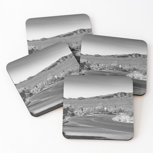 Item preview, A winding desert road curves through a landscape dotted with cacti, set against a backdrop of distant mountains designed and sold by EyezWatchin.