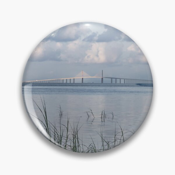 Item preview, The Sunshine Skyway Bridge Tampa Bay Pinellas County Florida is framed by tall grasses in the foreground designed and sold by EyezWatchin.