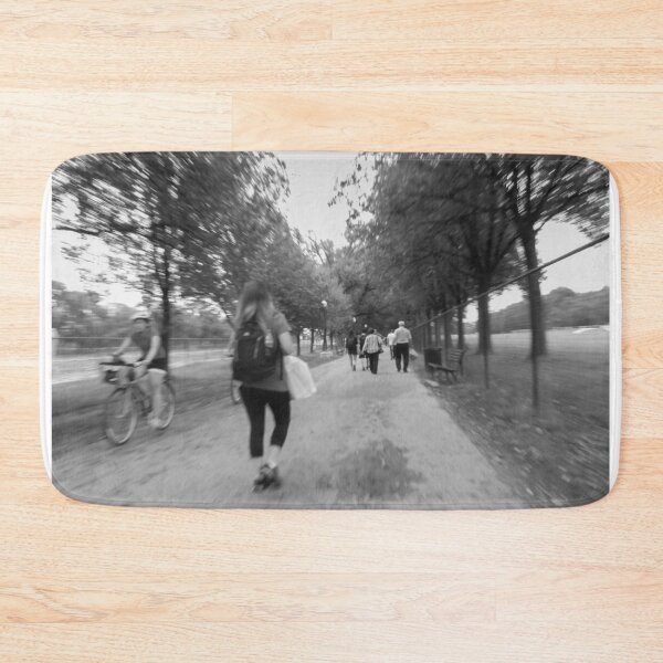 Item preview, A monochrome scene captures people walking and biking along a tree-lined path in a The National Mall Washington DC 2011 designed and sold by EyezWatchin.