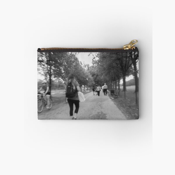 Item preview, A monochrome scene captures people walking and biking along a tree-lined path in a The National Mall Washington DC 2011 designed and sold by EyezWatchin.