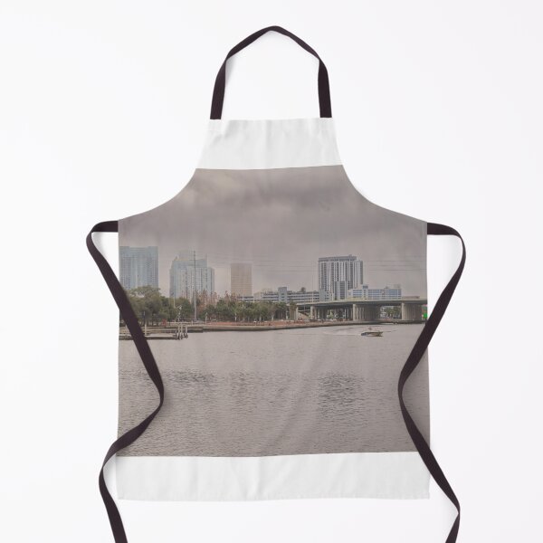 Item preview, A boat glides up the Tampa Bay Riverwalk under a dramatic cloudy sky designed and sold by EyezWatchin.