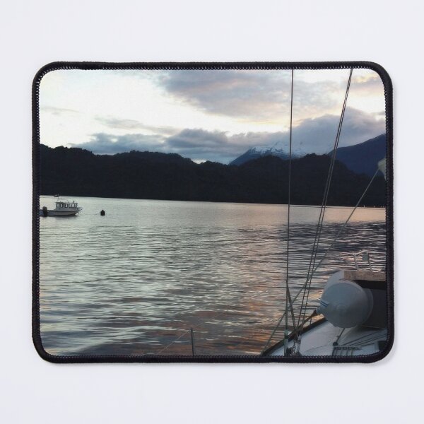 Item preview, Clouds at sunset reflect on the tranquil waters of Llancahue Island, Chiloé. designed and sold by MAMB007.