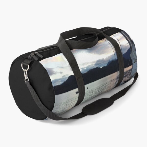 Item preview, Clouds at sunset reflect on the tranquil waters of Llancahue Island, Chiloé. designed and sold by MAMB007.