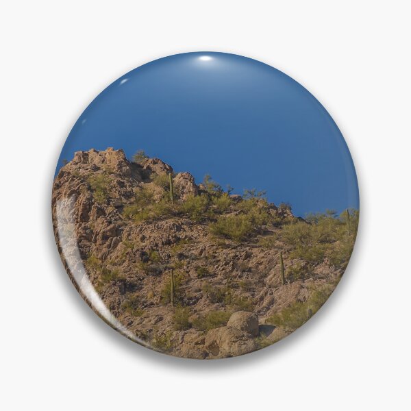Item preview, A rugged desert landscape features rocky hills dotted with cacti under a clear blue sky designed and sold by EyezWatchin.