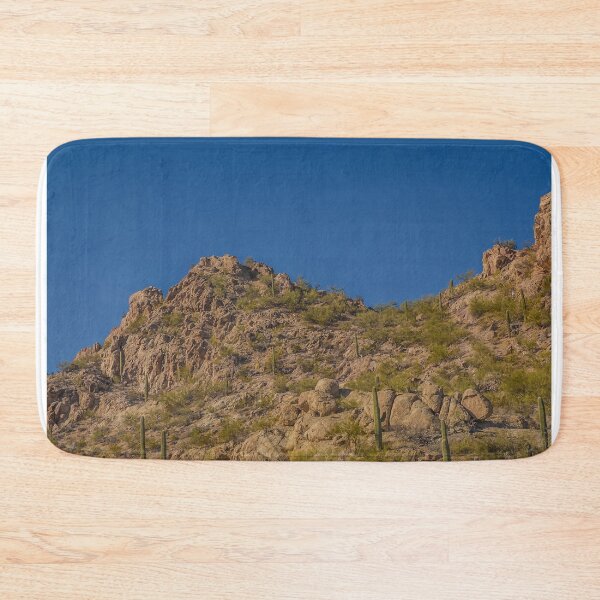 Item preview, A rugged desert landscape features rocky hills dotted with cacti under a clear blue sky designed and sold by EyezWatchin.