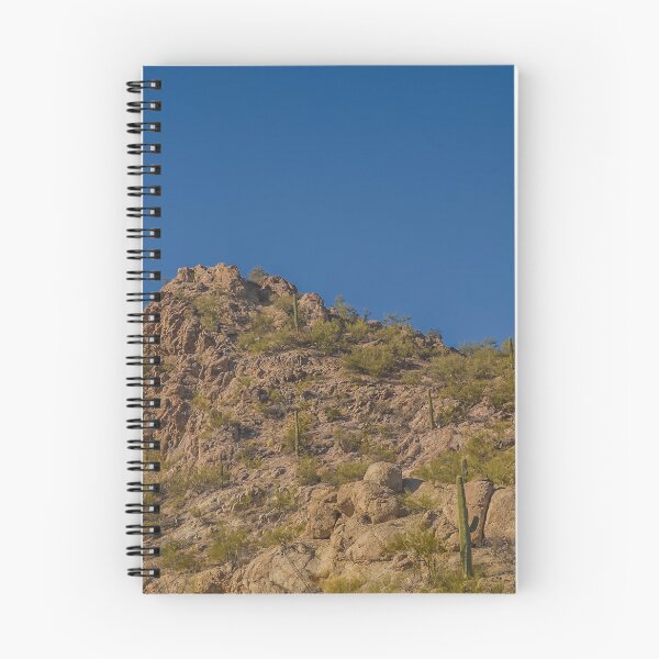 Item preview, A rugged desert landscape features rocky hills dotted with cacti under a clear blue sky designed and sold by EyezWatchin.