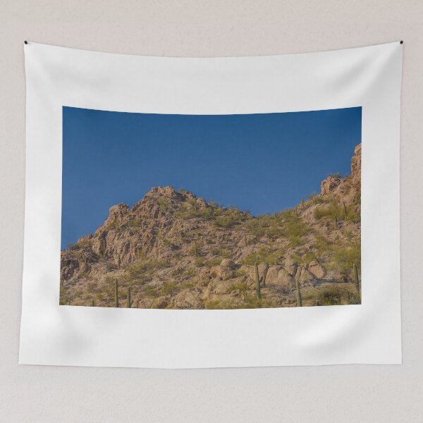 Item preview, A rugged desert landscape features rocky hills dotted with cacti under a clear blue sky designed and sold by EyezWatchin.