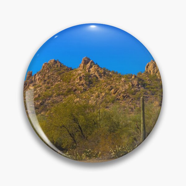 Item preview, A scenic desert landscape features rugged hills under a vibrant blue sky designed and sold by EyezWatchin.