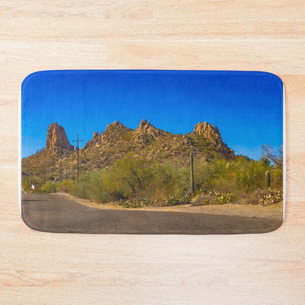 Item preview, A scenic desert landscape features rugged hills under a vibrant blue sky designed and sold by EyezWatchin.