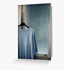Hanging T-shirt and broken window pane Greeting Card