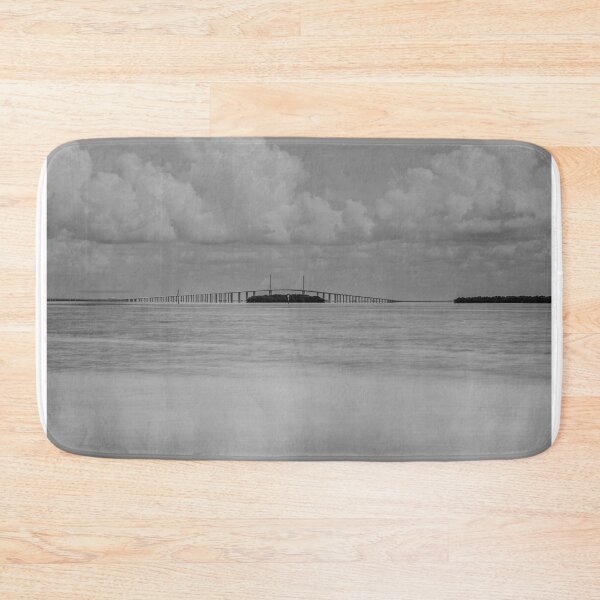 Item preview, A serene black and white scene features the long Sunshine Skyway Bridge extending over a calm body of Tampa Bay designed and sold by EyezWatchin.