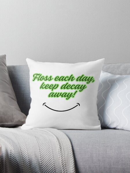 Item preview, A green text that says "Floss each day, keep decay away!" with a smile underneath designed and sold by Healthcare Cuties.