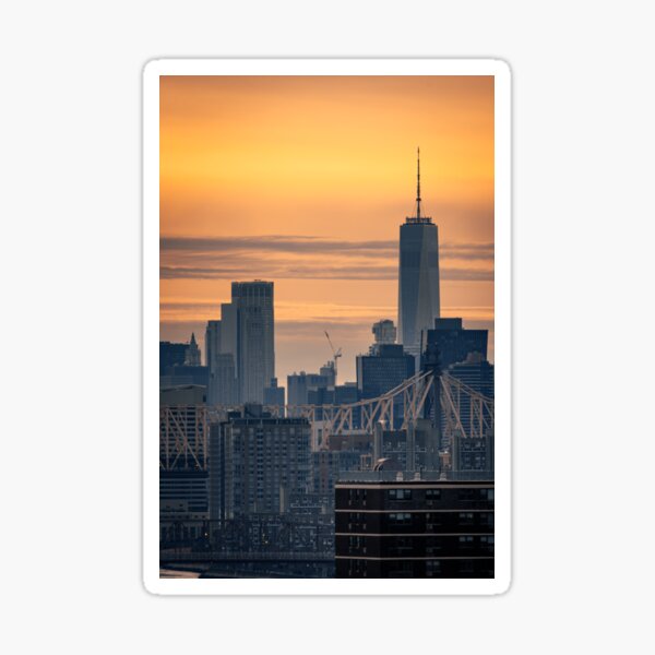 A sunset view of Manhattan with WTC and Queensboro Bridge Sticker
