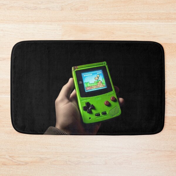 Item preview, Hand holding Green Gameboy Color designed and sold by teesresolution.