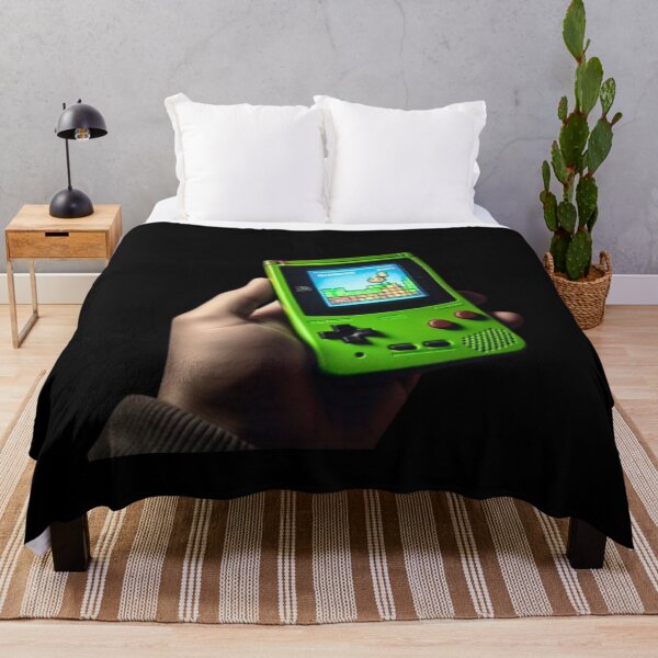Item preview, Hand holding Green Gameboy Color designed and sold by teesresolution.