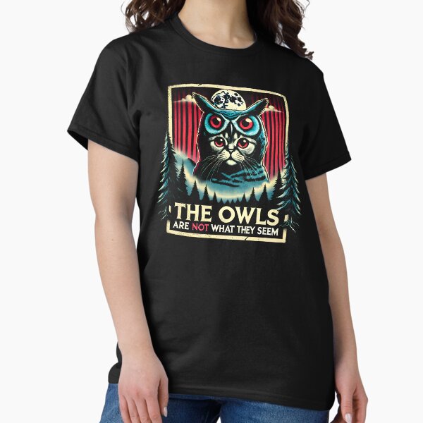 Item preview, The Owls Are Not What They Seem: Cat in an owl costume eerie Twin Peaks artwork funny shirt designed and sold by Dollycat Industries.
