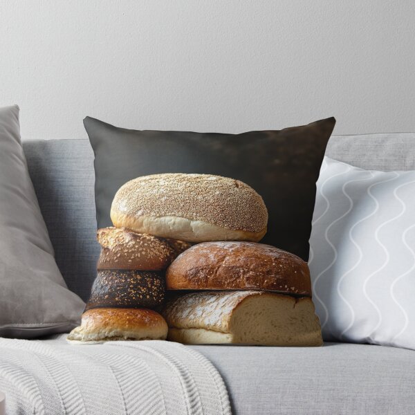 Item preview, Assortment of freshly baked breads of different types stacked on a dark background designed and sold by Jerhus.