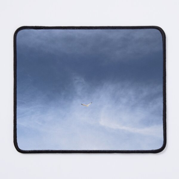 Item preview, A bird flying in the cloudy blue sky designed and sold by Phakade's Photos.