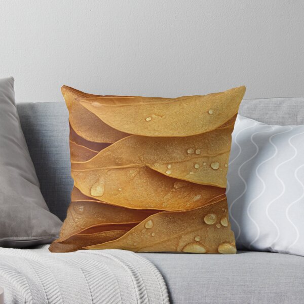 Item preview, Close-up of golden leaves with water droplets, creating a textured and natural composition in soft lighting designed and sold by anytka.