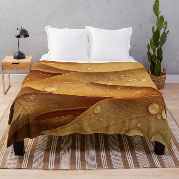 Item preview, Close-up of golden leaves with water droplets, creating a textured and natural composition in soft lighting designed and sold by anytka.