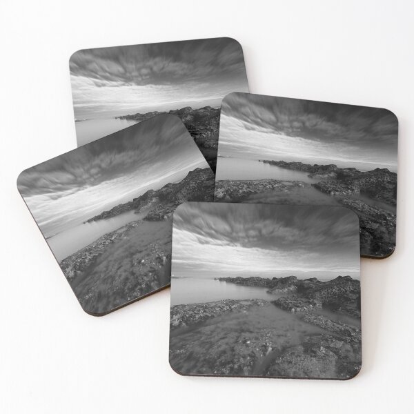 Item preview,  Scenic Coastal Rock Formation Under a Vibrant Cloudy Sky in black and white designed and sold by FotoMahieu.