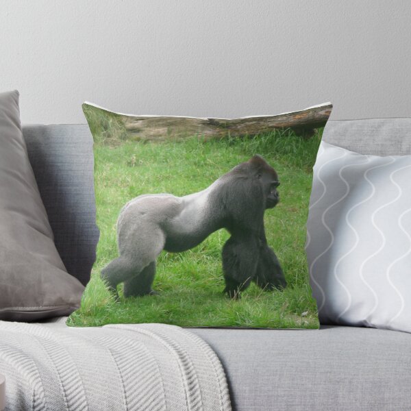 Gorilla male silverback great ape of Africa sitting in green jungle bushes  Throw Pillow