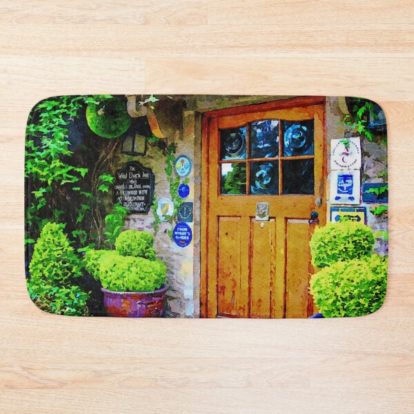 Item preview, Charming English inn entrance with rustic wooden door and vibrant greenery designed and sold by GestaltImagery.