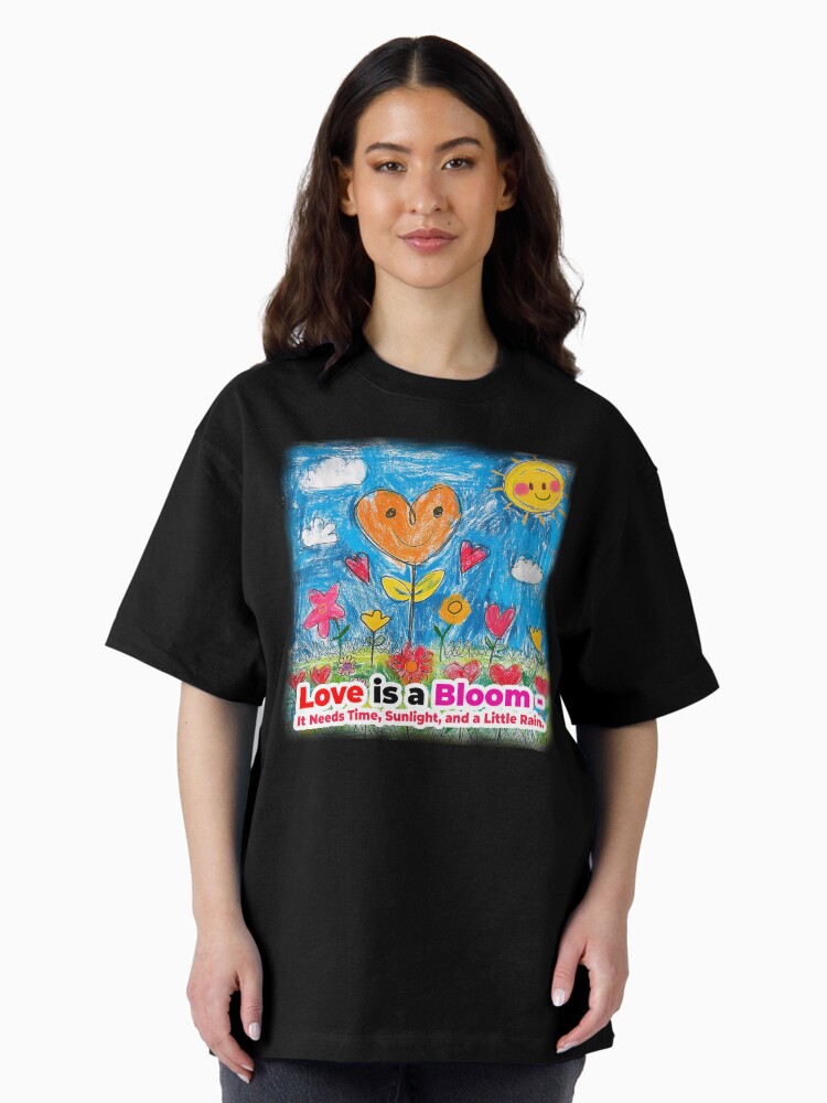 Thumbnail 1 of 7, Oversized T-Shirt, Love is a Bloom—It Needs Time, Sunlight, and a Little Rain. designed and sold by Finvara.