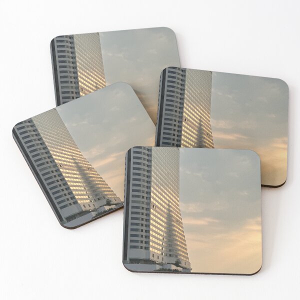 Item preview, A low-angle shot of the Millennium Hilton Bangkok hotel, illuminated by the warm light of the setting sun designed and sold by BARTISTA DESIGN.