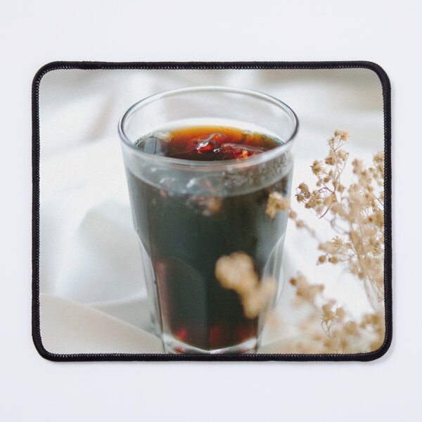 Item preview, A close-up shot of a glass filled with a dark beverage, likely nitro cold brew coffee, on a white, textured fabric. designed and sold by BARTISTA DESIGN.