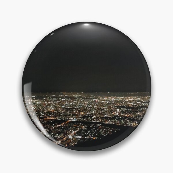 Item preview, A panoramic view of a city at night, seen from an elevated vantage point. The cityscape is illuminated with countless lights, creating a sparkling effect against the dark background.  designed and sold by BARTISTA DESIGN.