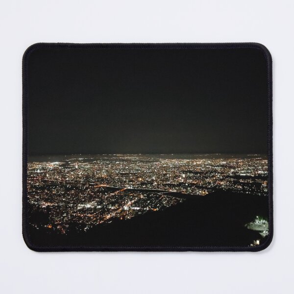 Item preview, A panoramic view of a city at night, seen from an elevated vantage point. The cityscape is illuminated with countless lights, creating a sparkling effect against the dark background.  designed and sold by BARTISTA DESIGN.
